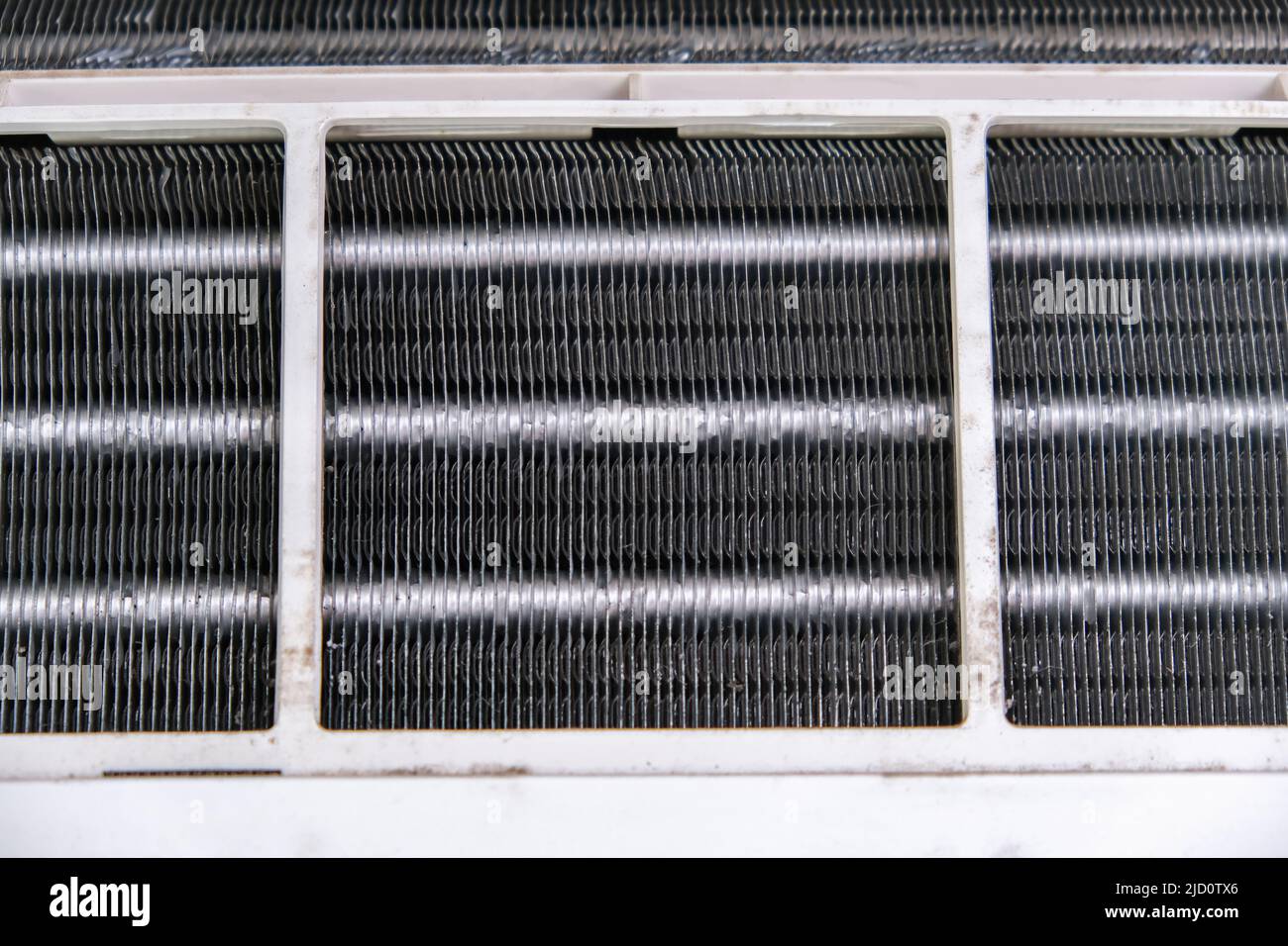 Mold and dust on the radiator grille of the air conditioner