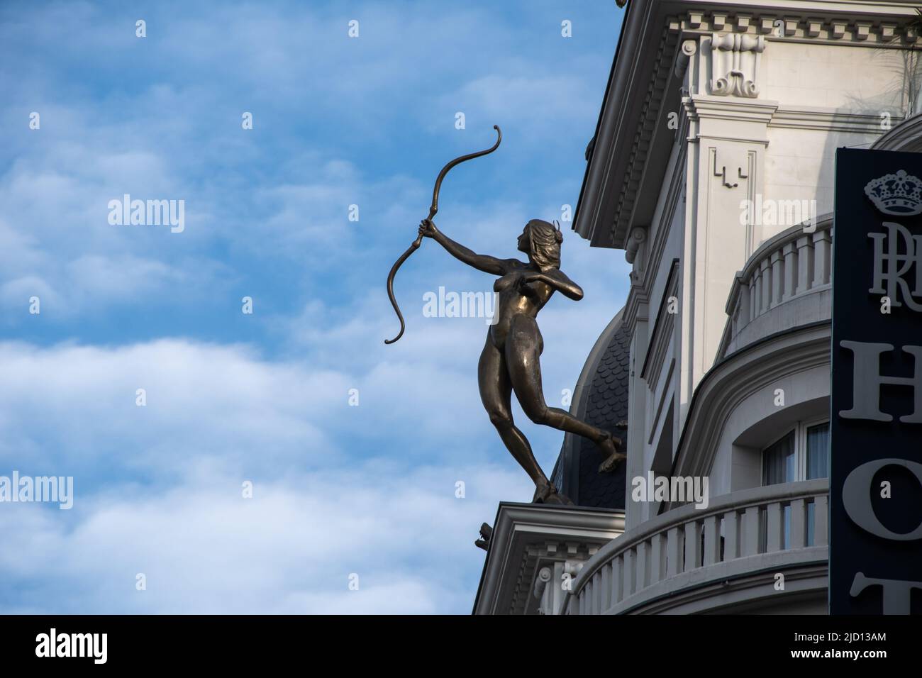 Statue of Diana the Huntress high above the rooftops, Madrid, Spain Stock Photo