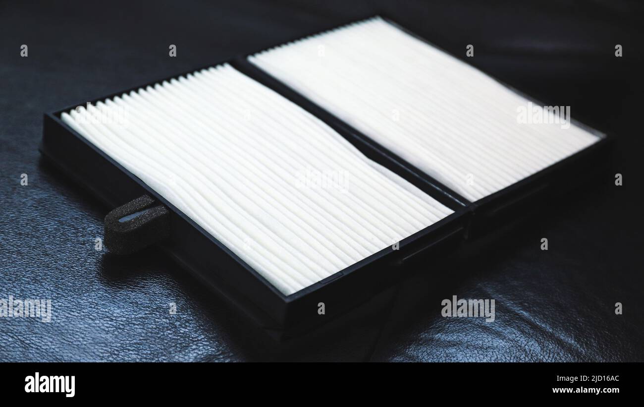 New car air filter on a leather black car seat Stock Photo Alamy