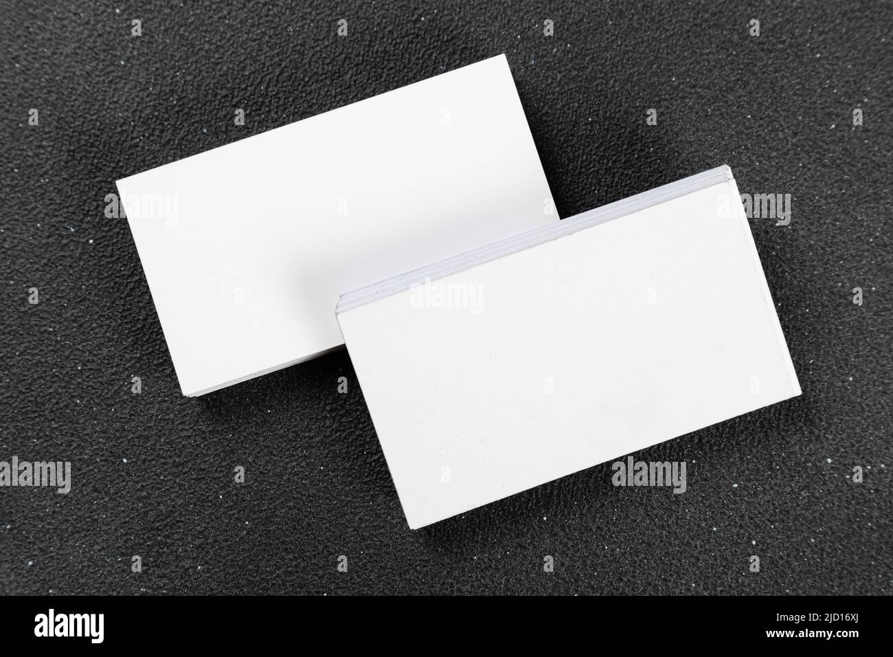 Photos of business cards. Mock-up for corporate identity on a black background. For graphic designers presentations and portfolios Stock Photo