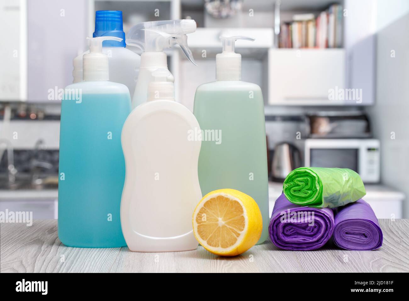 Plastic bottles of dishwashing liquid, glass and tile cleaner