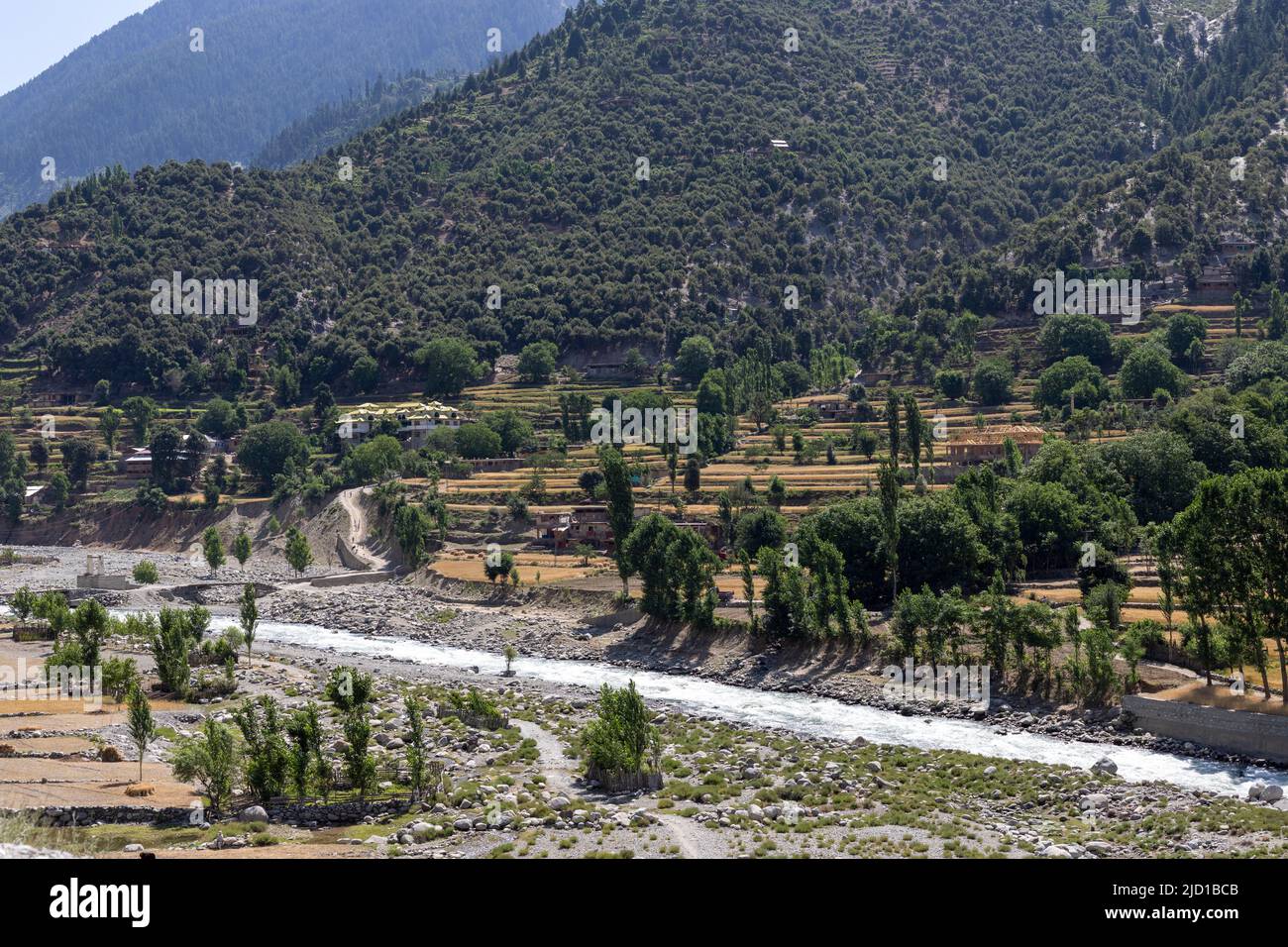 Beautiful landscape view of upper dir river and wheat fields Stock Photo