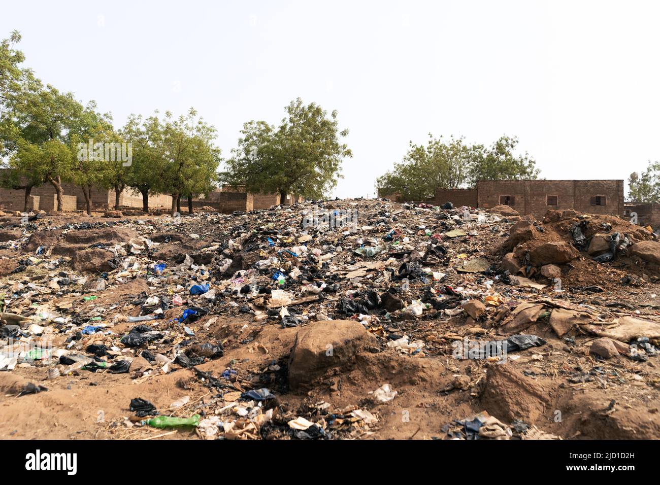 Scattered plastic trash litter and other garbage in an African urban setting; concept of lack of solid waste management Stock Photo