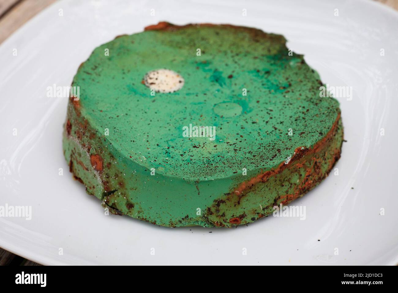 Green cheesecake (actually dried out old paint) Stock Photo