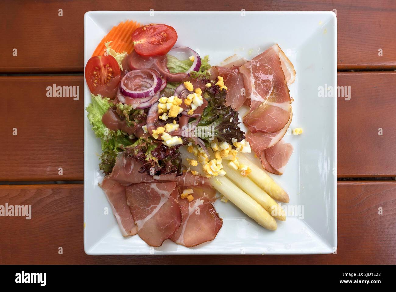 Asparagus salad with ham served in a Franconian inn, Bavaria, Germany Stock Photo