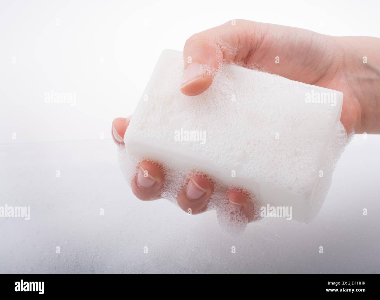 Hand washing and soap foam on a foamy background Stock Photo