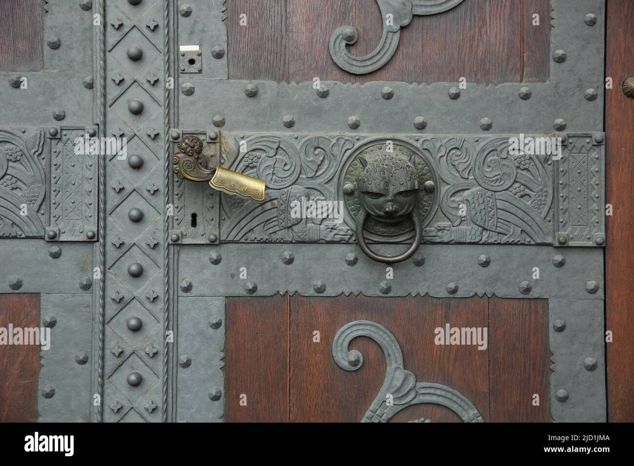 Door with fittings, door handle and door knocking ring at the Church of the Redeemer in Bad Homburg, Hesse, Germany Stock Photo