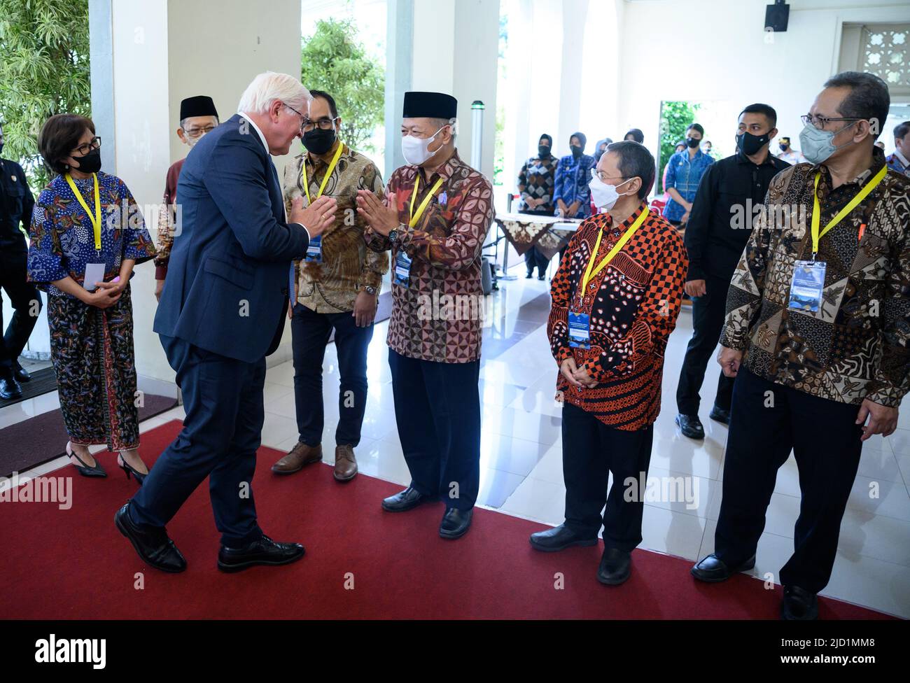 17 June 2022, Indonesia, Yogyakarta: German President Frank-Walter Steinmeier (2nd from left) is welcomed at Gadjah Mada University. President Steinmeier is on a two-day visit to Indonesia. He was previously in Singapore for two days. Photo: Bernd von Jutrczenka/dpa Stock Photo