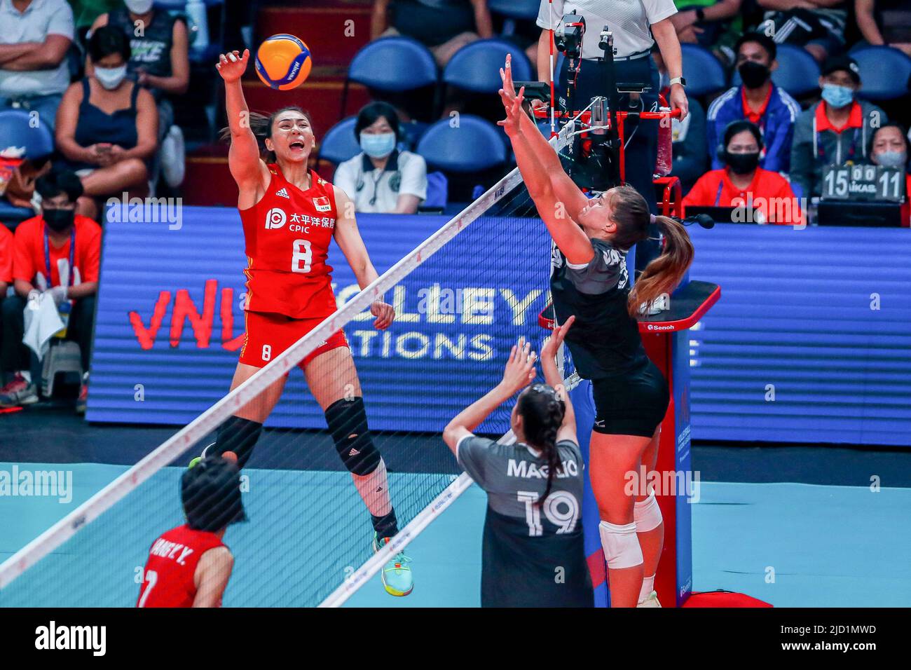 Quezon City. 17th June, 2022. Jin Ye (L) of China spikes during the FIVB Volleyball Nations