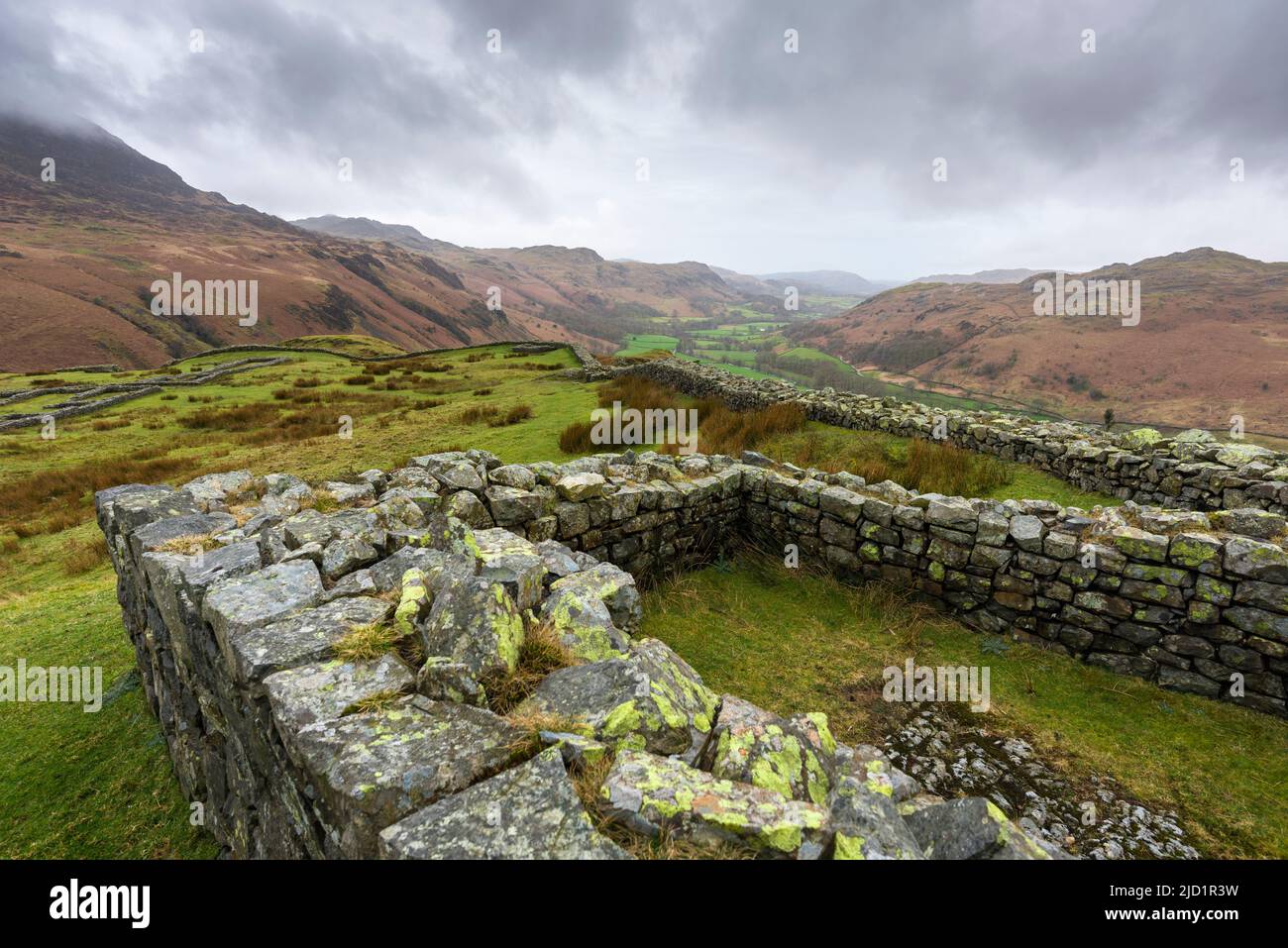 Hardknott Roman Fort and Eskdale Valley beyond in the Lake District National Park, Cumbria, England. Stock Photo