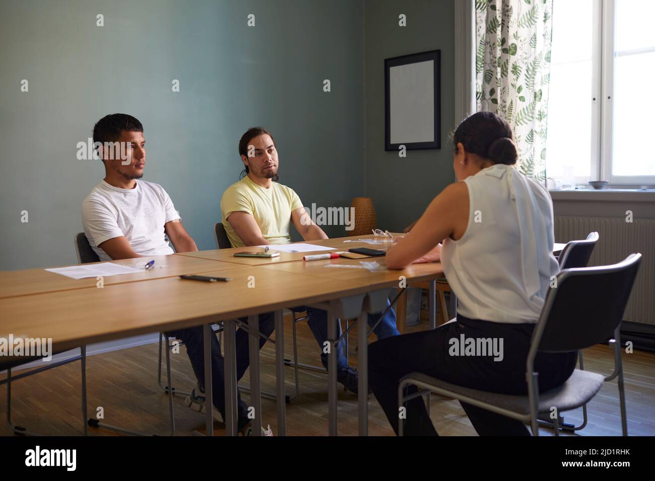 People in boardroom during business meeting Stock Photo