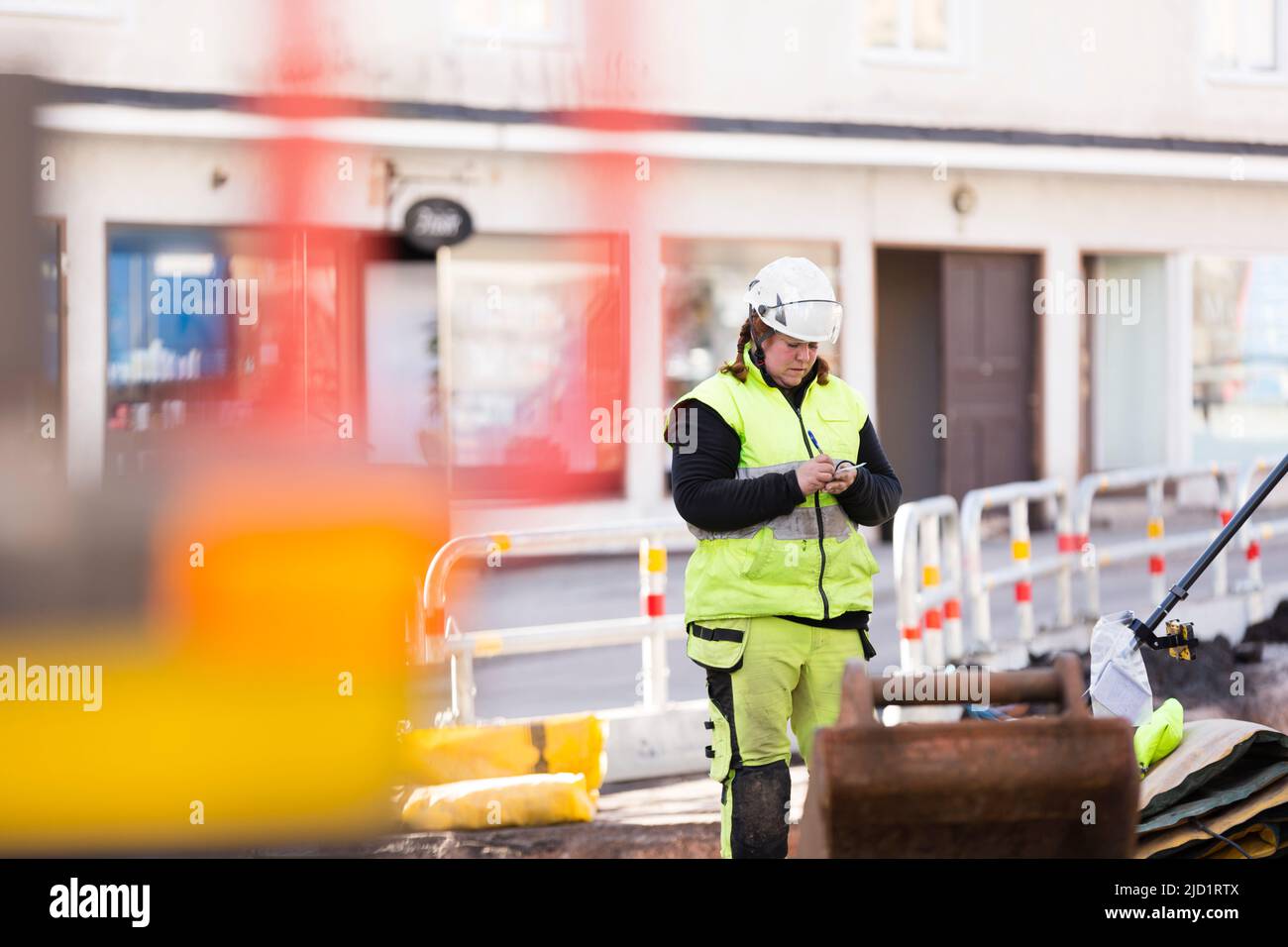 Worker in reflective clothing during work Stock Photo