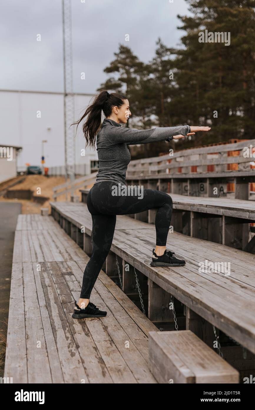 Woman exercising outdoors Stock Photo