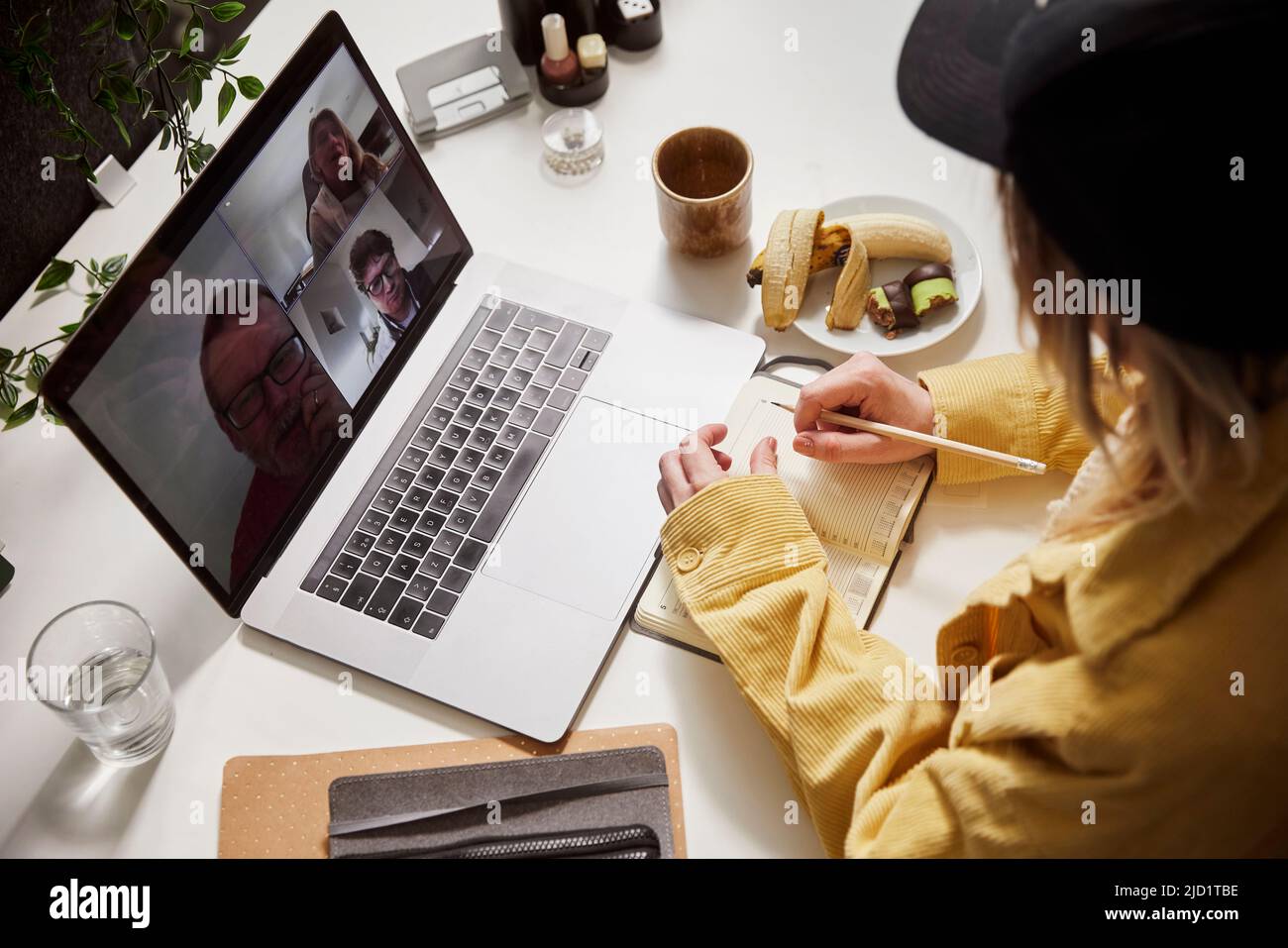Woman using laptop in office Stock Photo