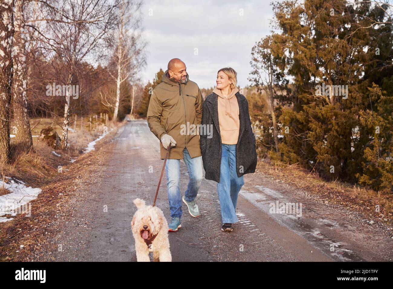 Two women walking dog together hi-res stock photography and images - Alamy