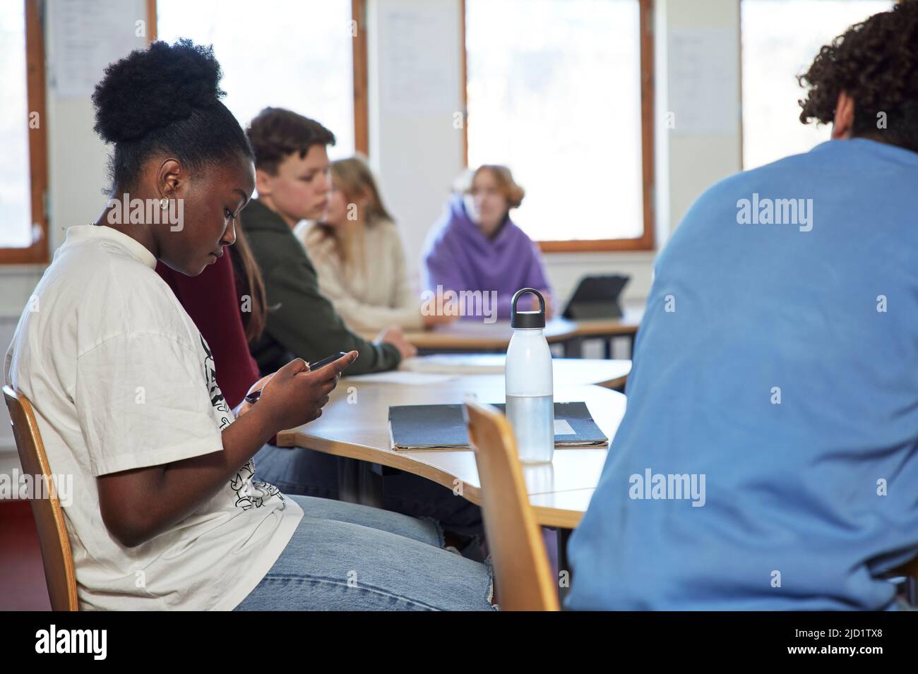 Group of students sitting in class Stock Photo
