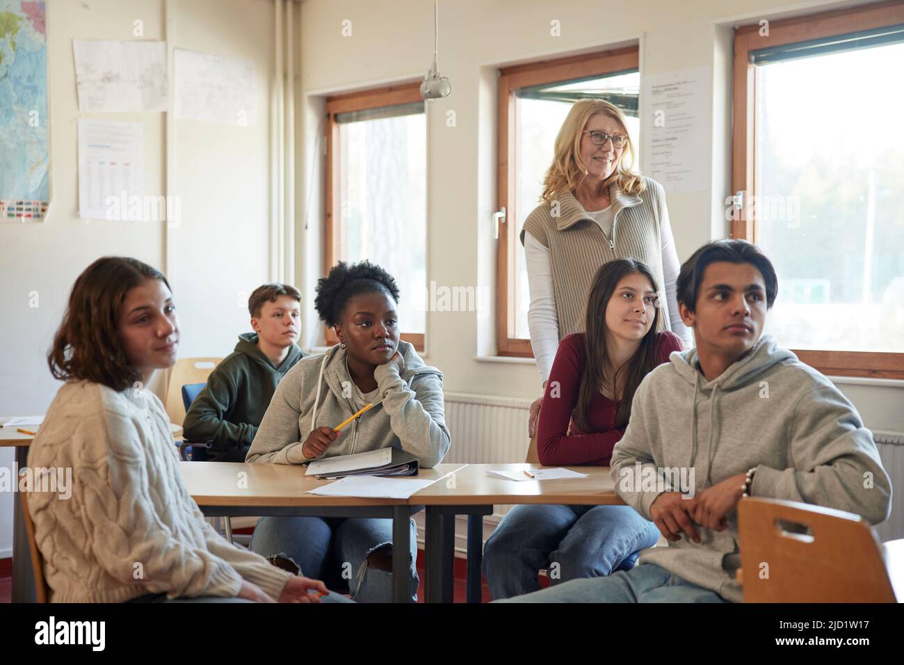 Group of students and teacher in class Stock Photo