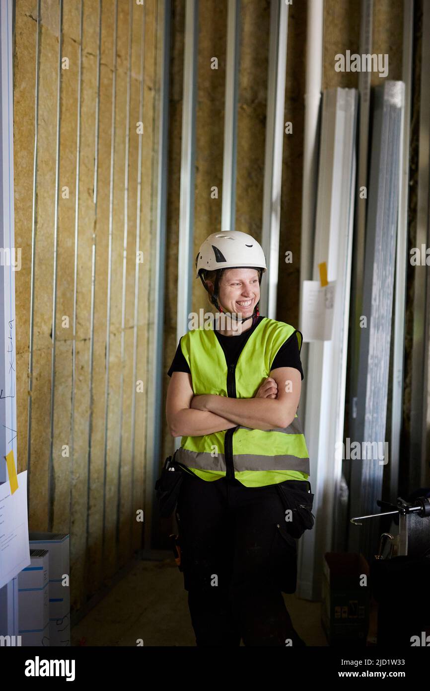 Smiling worker looking away Stock Photo