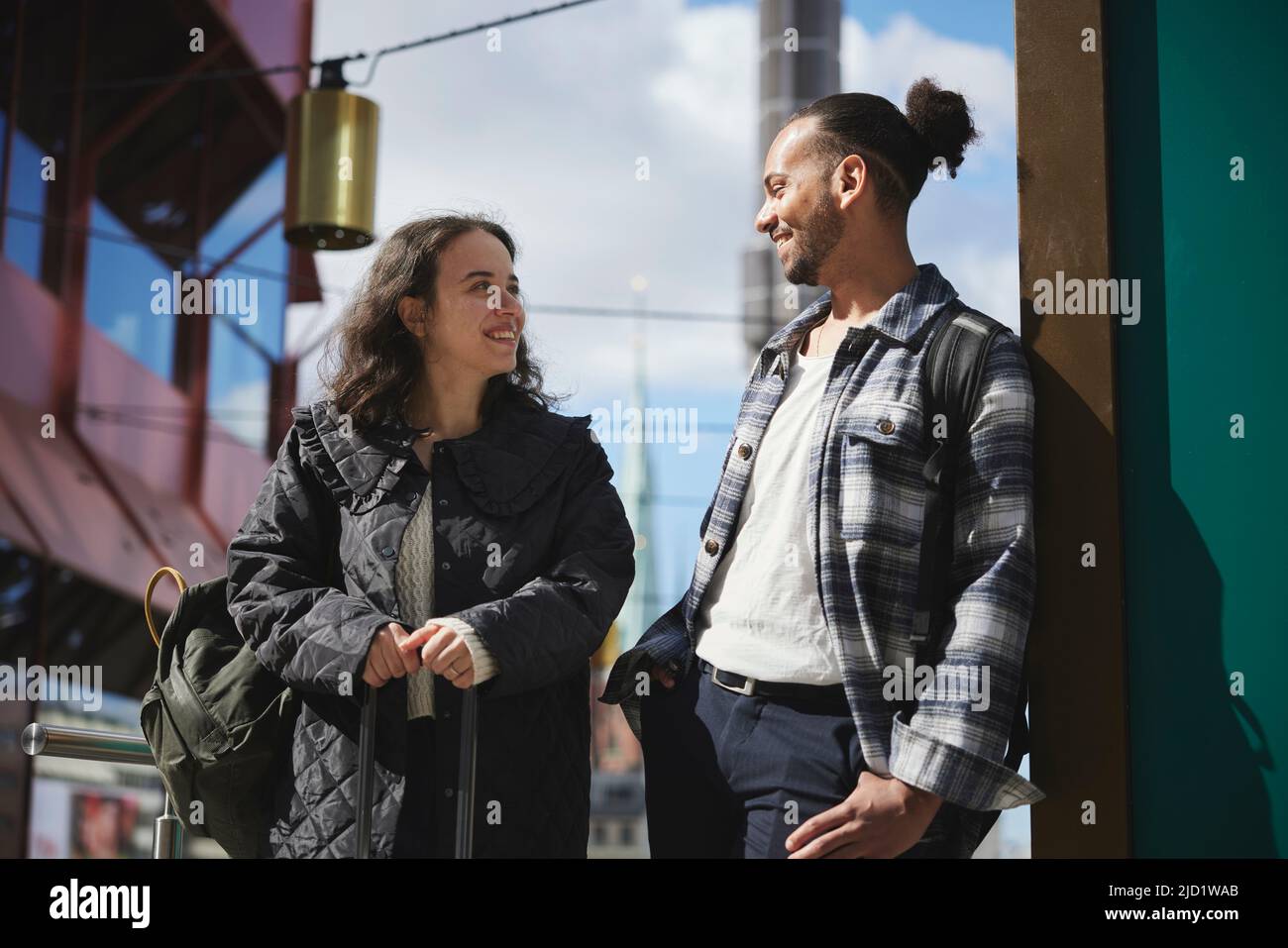 Smiling man and woman standing outdoors Stock Photo