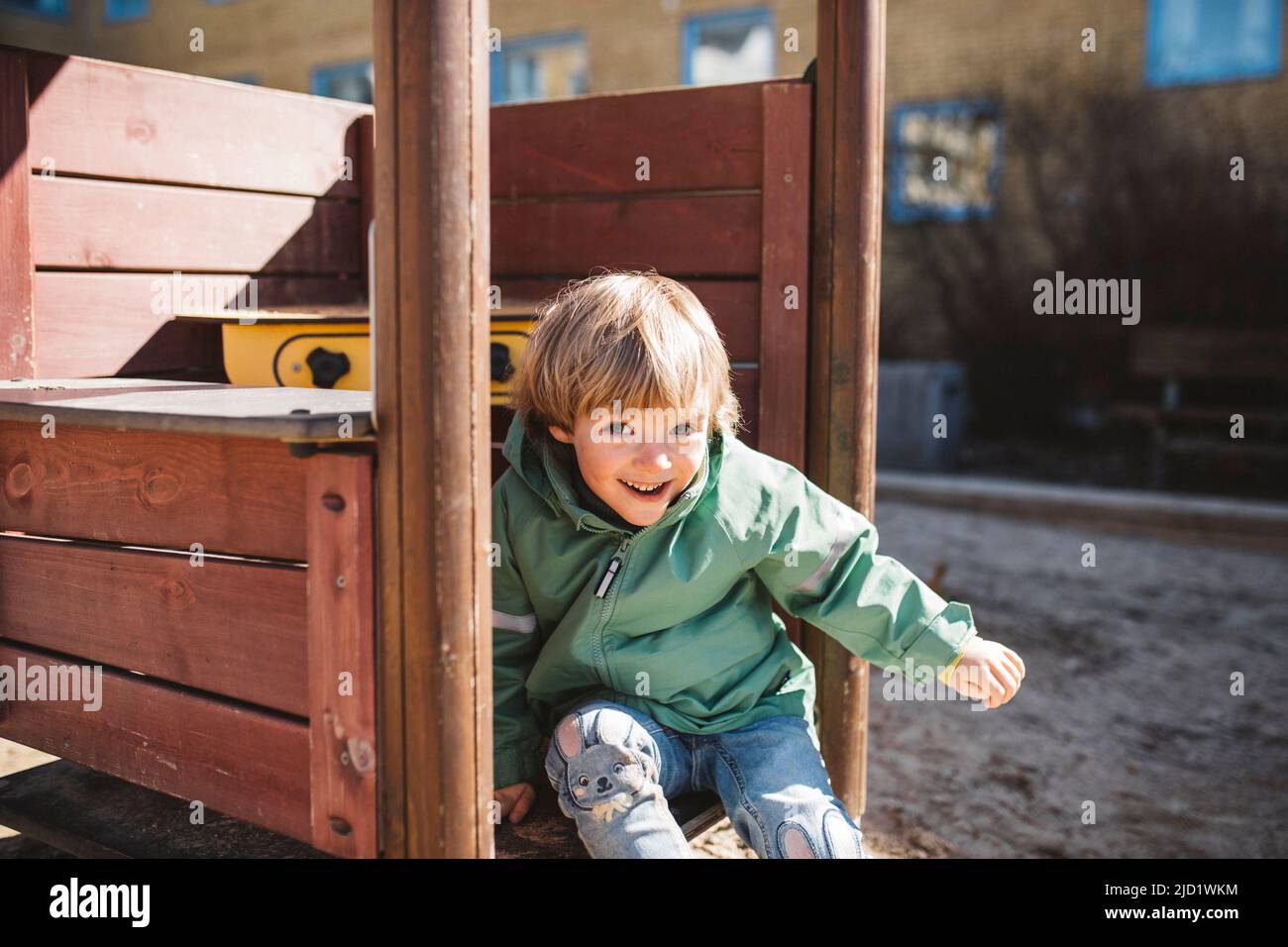 Boy having fun on playground Stock Photo