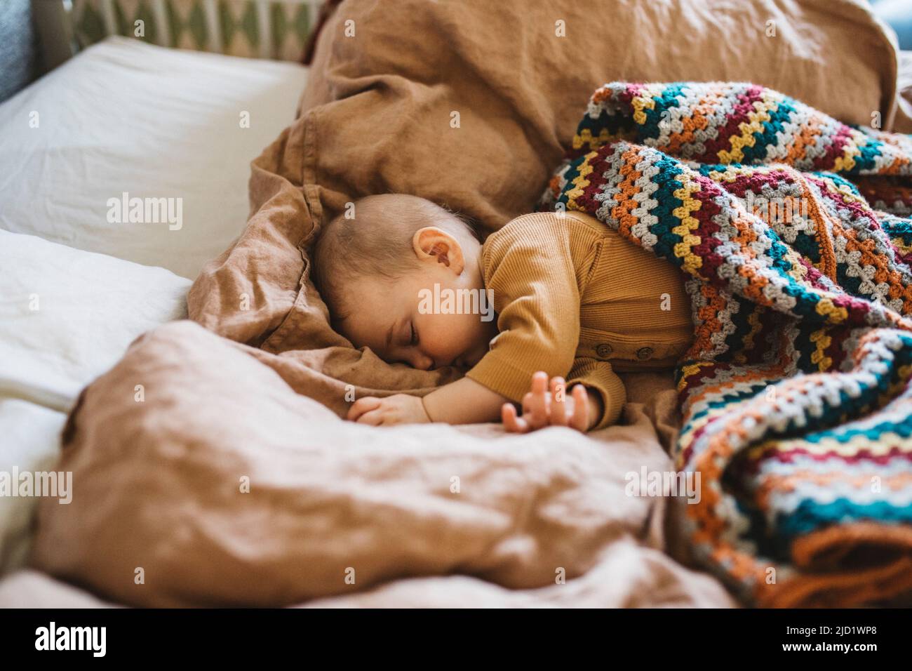 Baby sleeping on bed Stock Photo Alamy