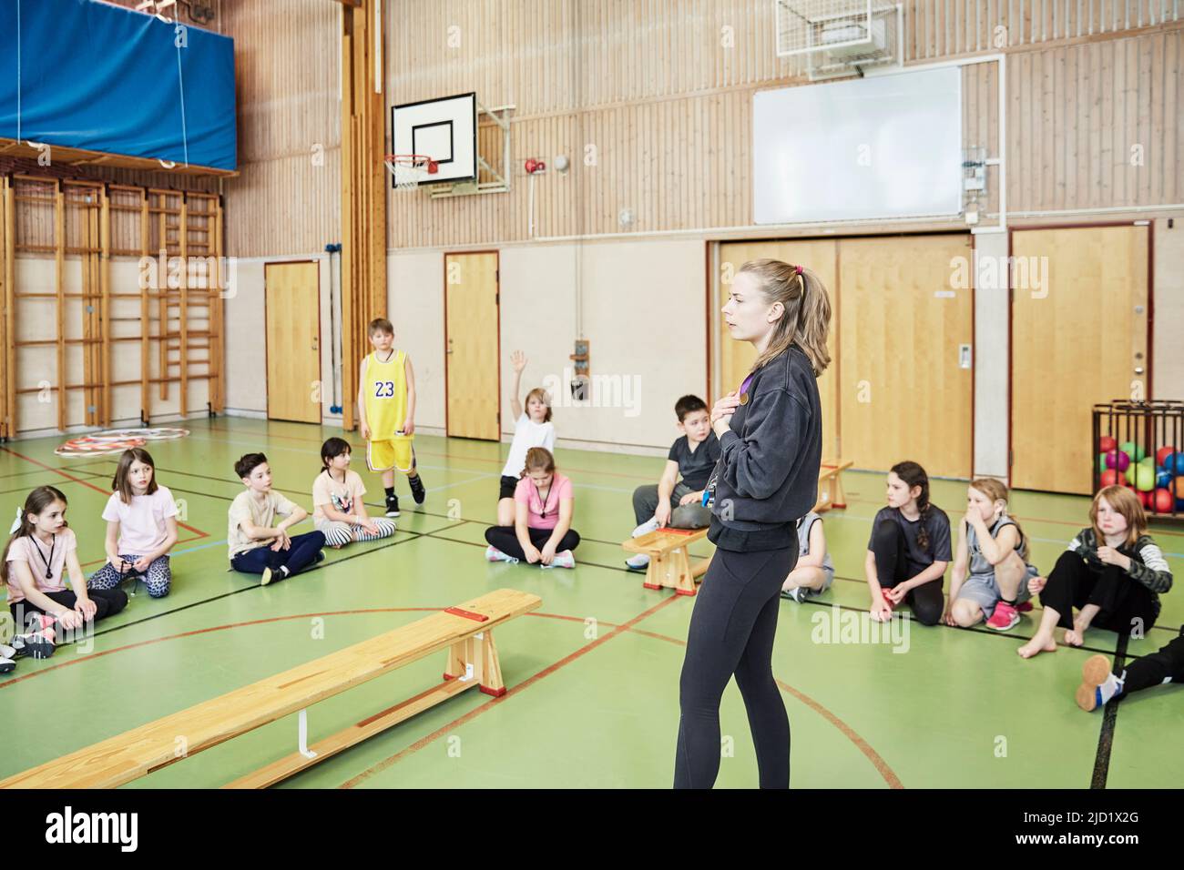 Children having class in school gym Stock Photo