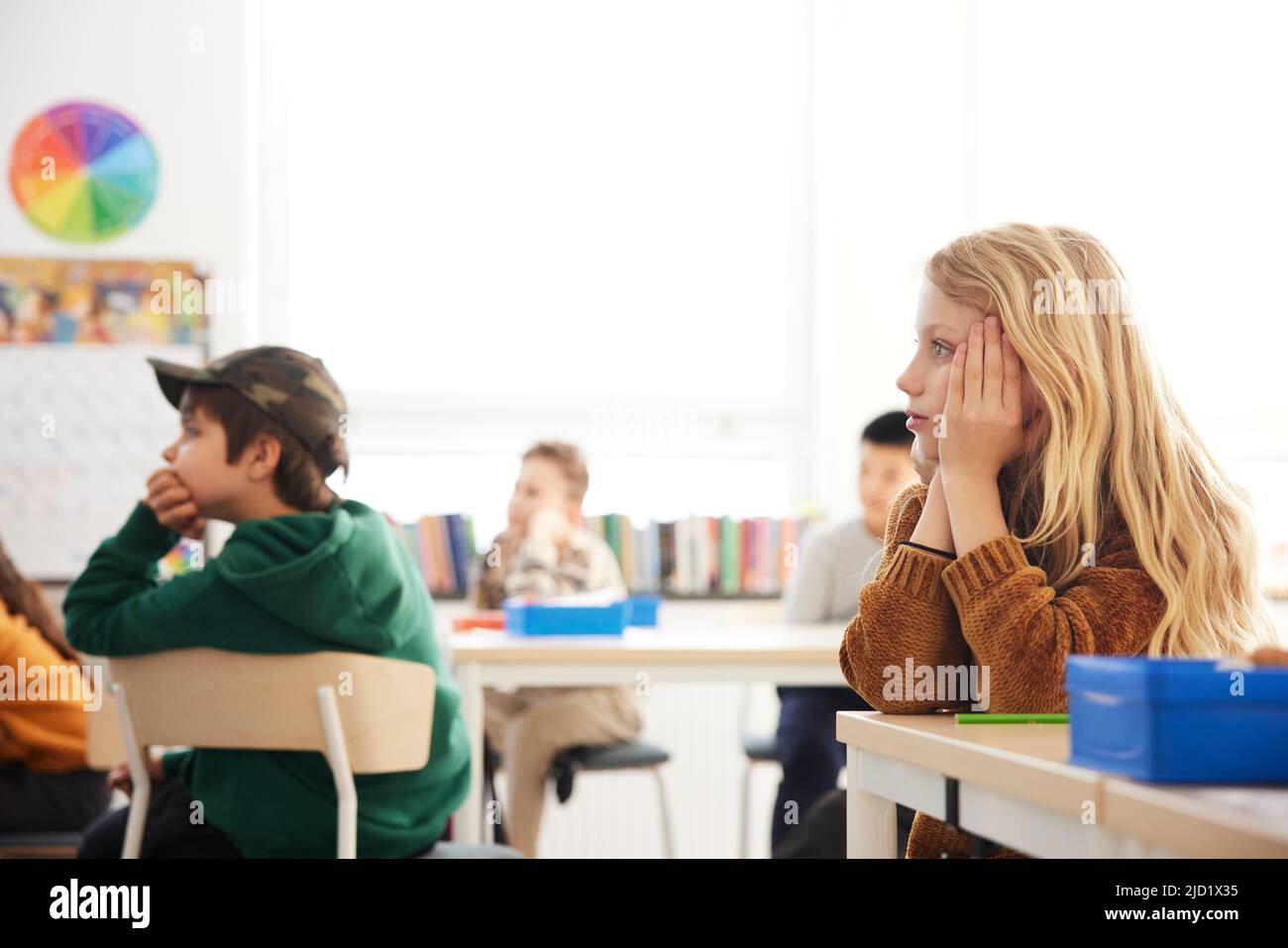 Girl sitting in classroom Stock Photo - Alamy