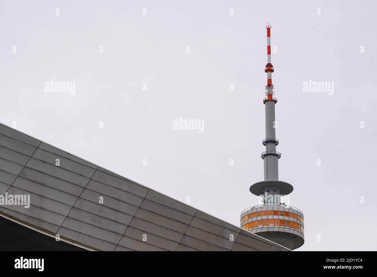 View from BMW Welt of the Olympic Tower, the 291 m high television tower in Munich and one of the city's landmarks. Munich, Germany, 19.2.22 Stock Photo