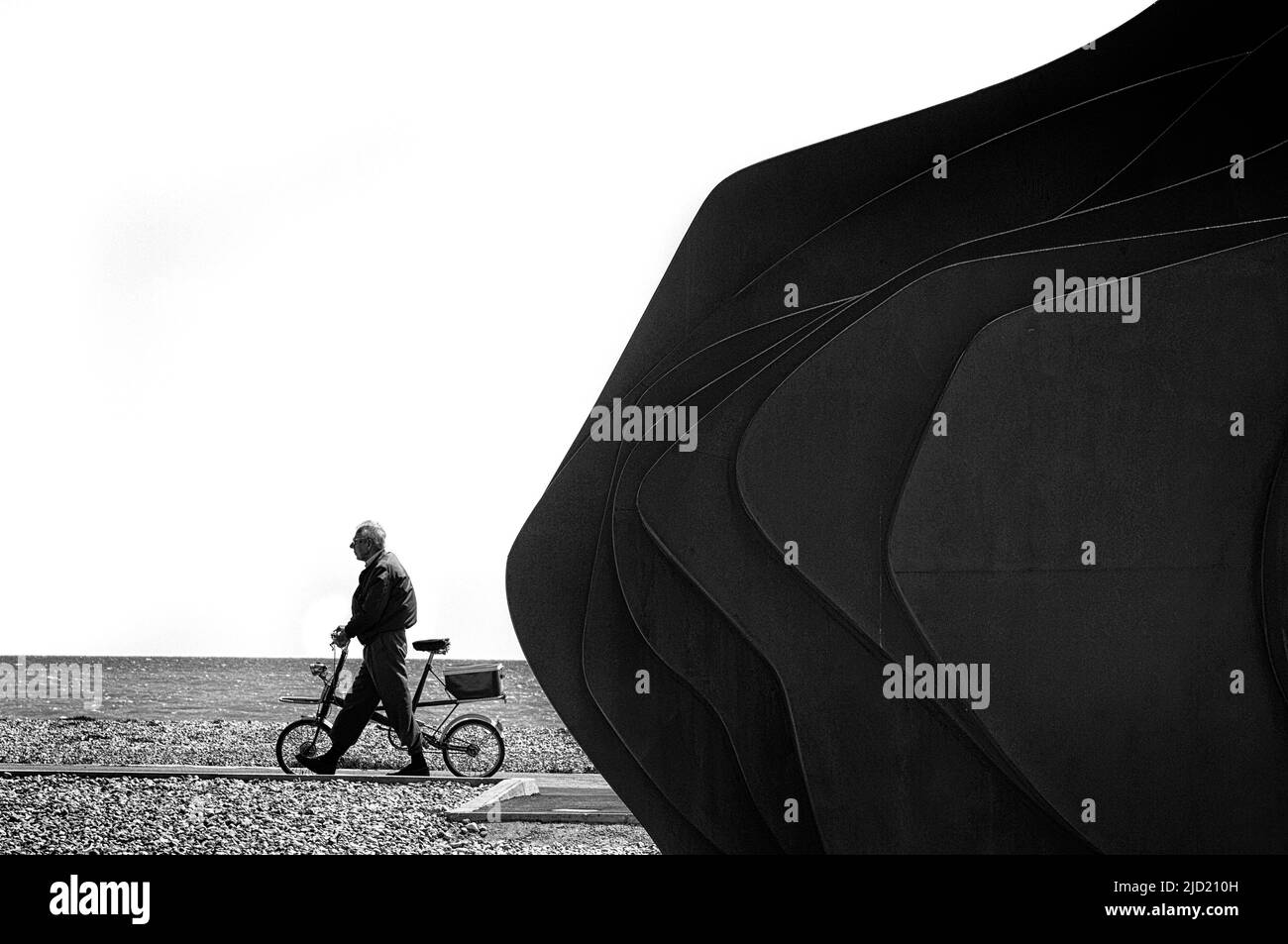 Cyclist passing The East Beach Cafe at Littlehampton. West Sussex. England, UK Stock Photo