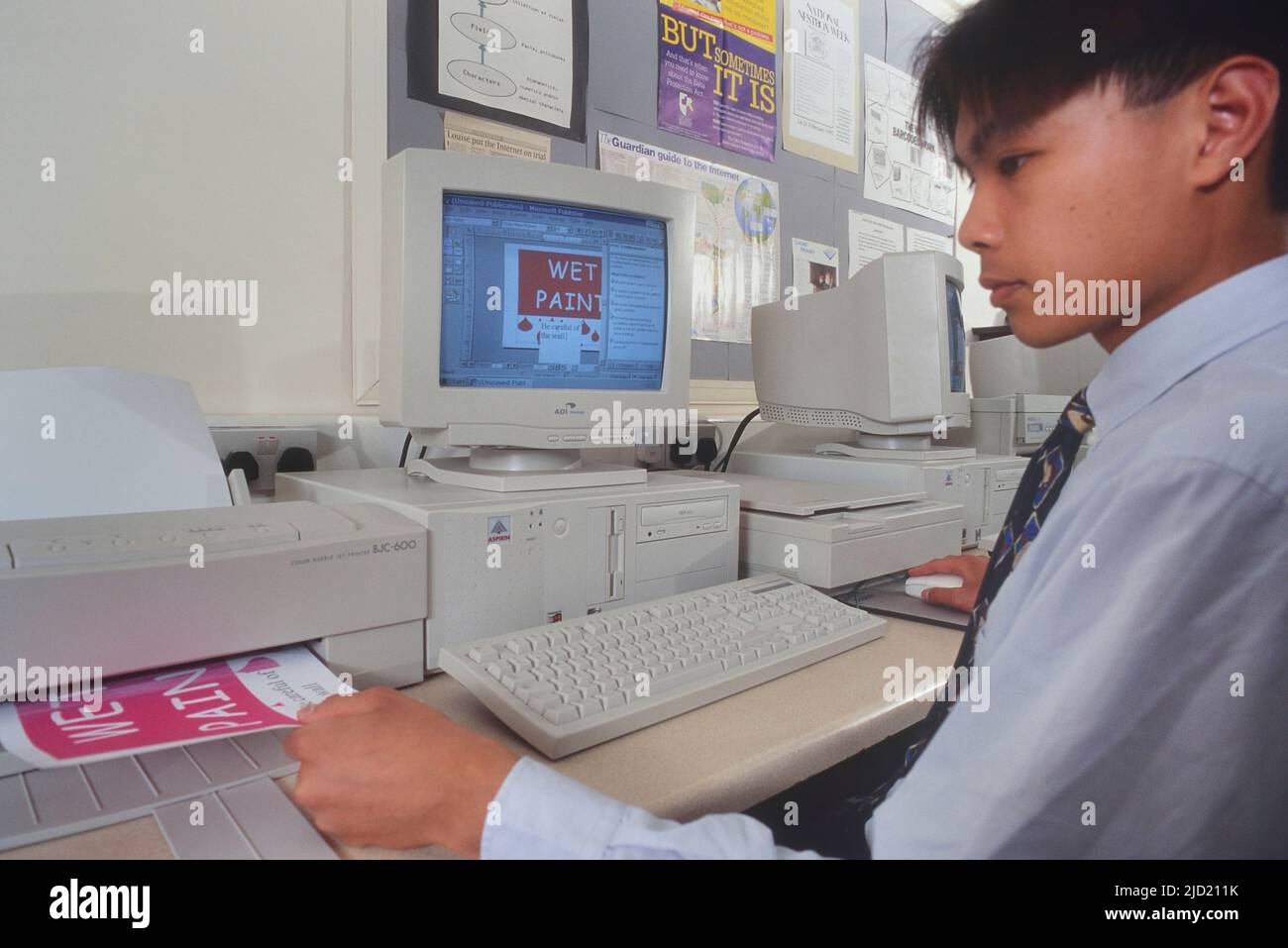 Young male student in a school computer room. Circa 1990s Stock Photo