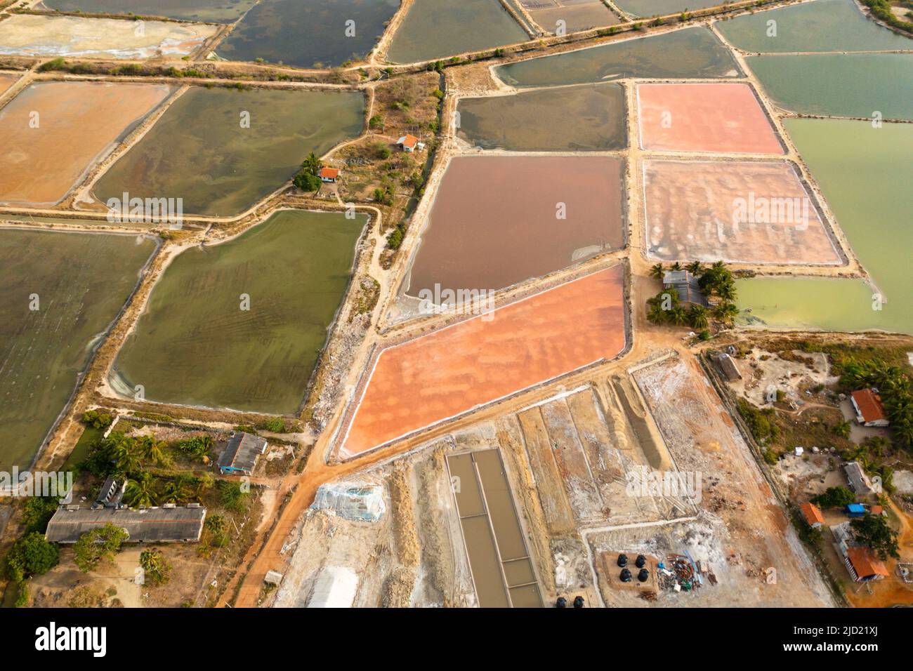 Extraction of salt from seawater by evaporation. Salt farm with pools