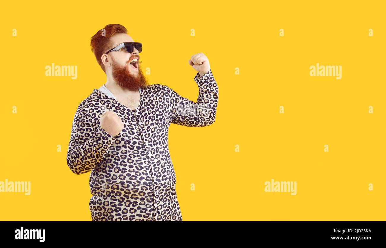 Crazy happy funny bearded fat man laughs out loud and sincerely rejoices in his success and triumph. Stock Photo