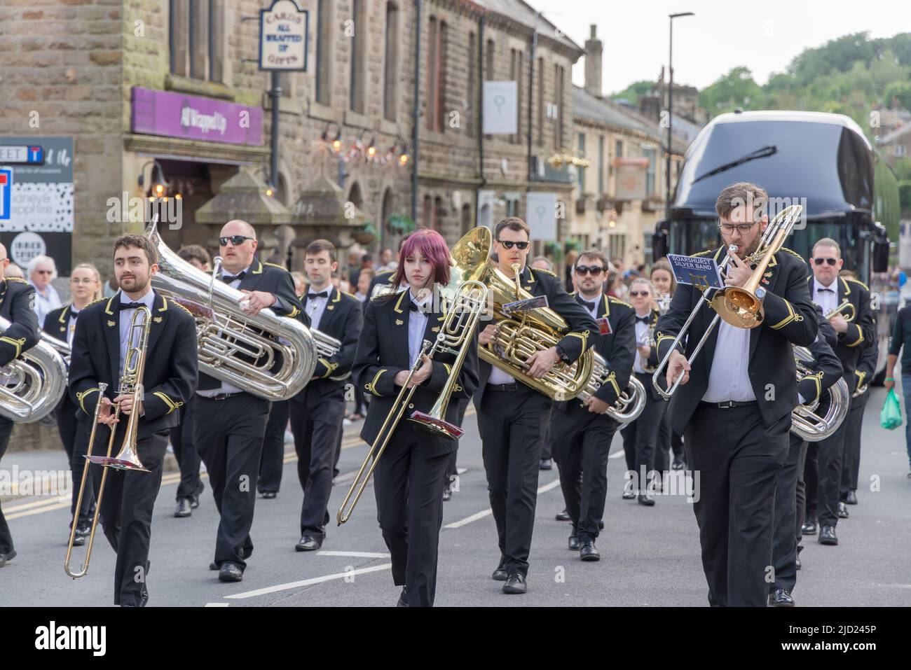 Brass bands marching on the street at the Uppermill Whit Friday Contest in Saddleworth, England. Stock Photo
