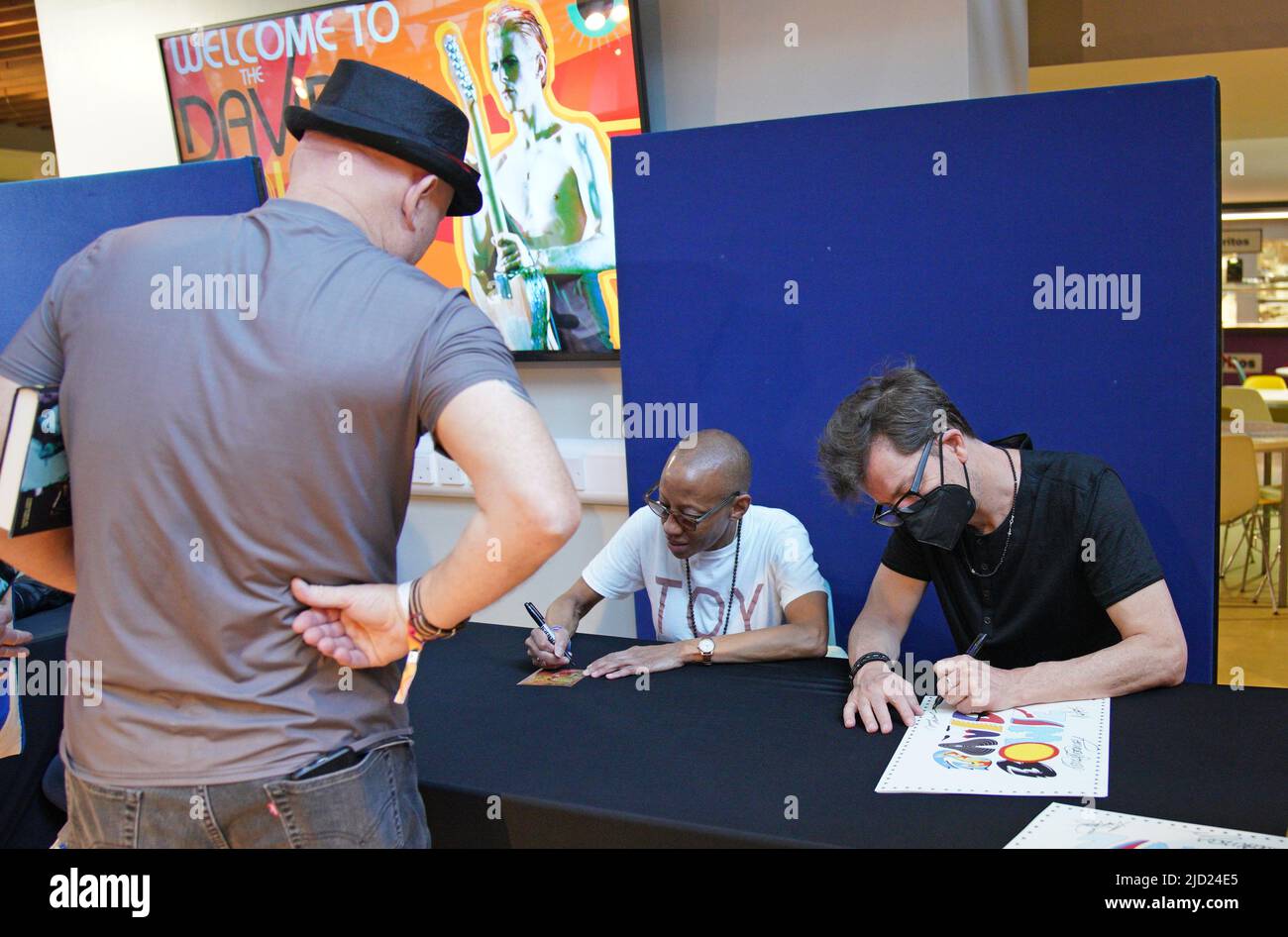 Former band members Gail Ann Dorsey and Donny McCaslin sign autographs during the World David Bowie Fan Convention at St George's Hall, in Liverpool. Picture date: Friday June 17, 2022. Stock Photo