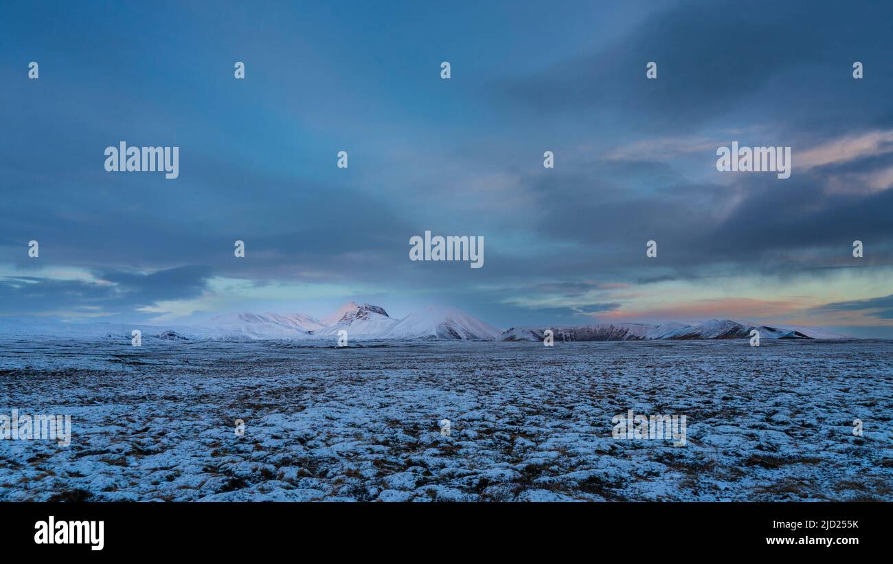 Snow-capped mountains at twilight, Thingvellir National Park, Iceland. Stock Photo