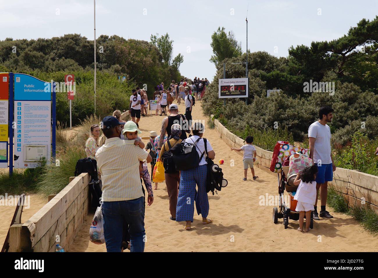 Camber, East Sussex, UK. 17 Jun, 2022. UK Weather: Hordes of visitors climb the sand dunes heading towards the beach at Camber on the East Sussex coast on one of the hottest days of the year so far. Photo Credit: Paul Lawrenson/Alamy Live News Stock Photo