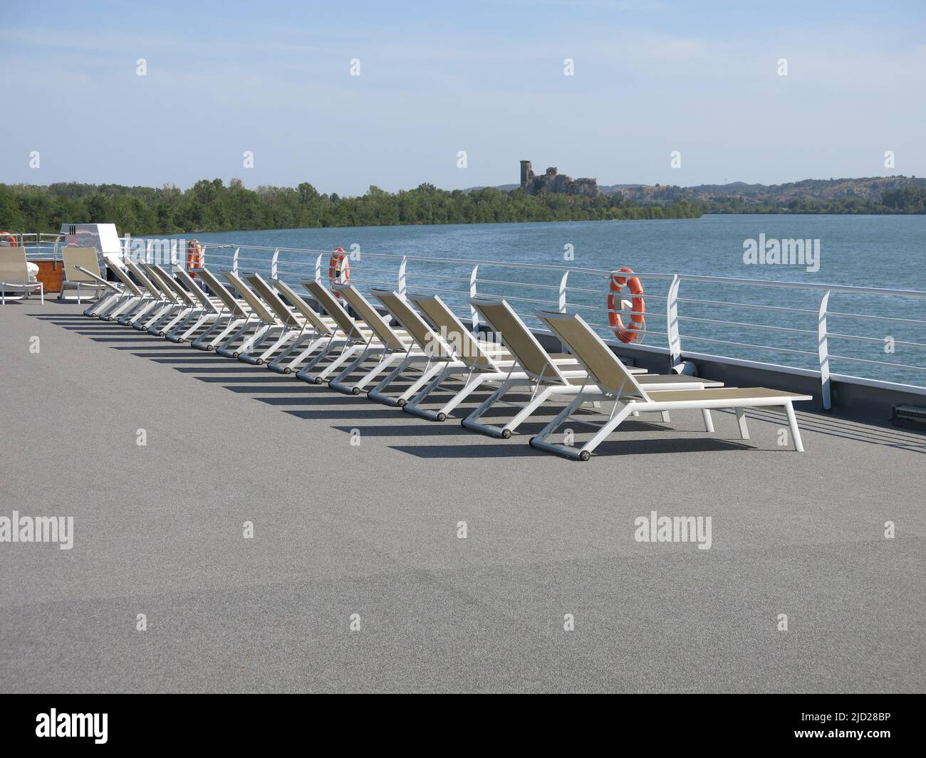 Rows of sunloungers on the top deck of the MS Van Gogh whilst cruising along the River Rhone in southern France. Stock Photo