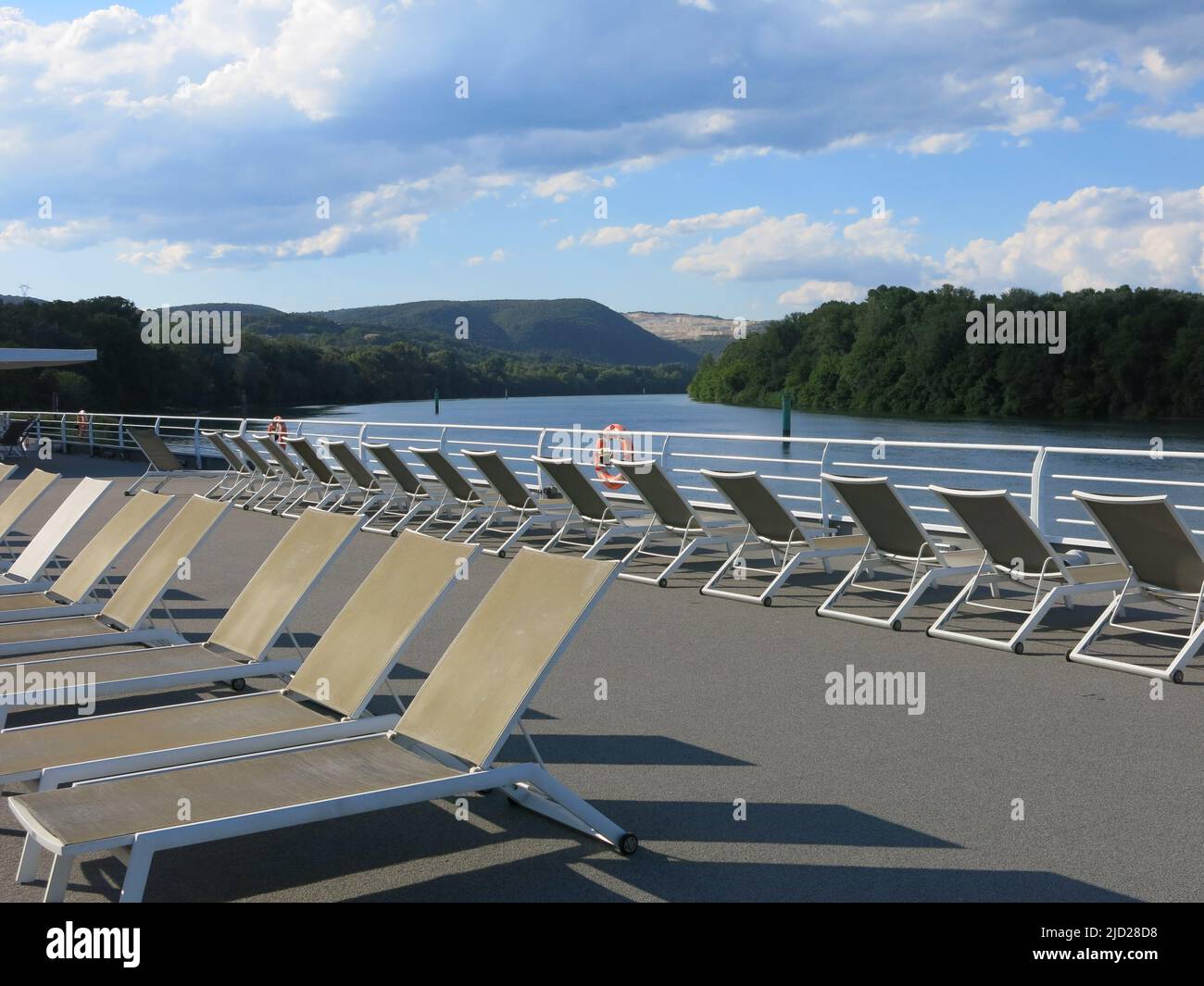 Rows of sunloungers on the top deck of the MS Van Gogh whilst cruising along the River Rhone in southern France. Stock Photo