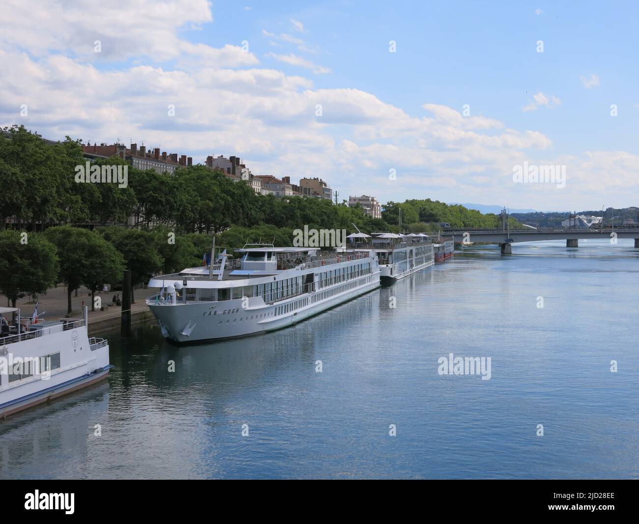 River cruising in Europe: cruise ships moored alongside the banks of the River Rhone in southern France. Stock Photo