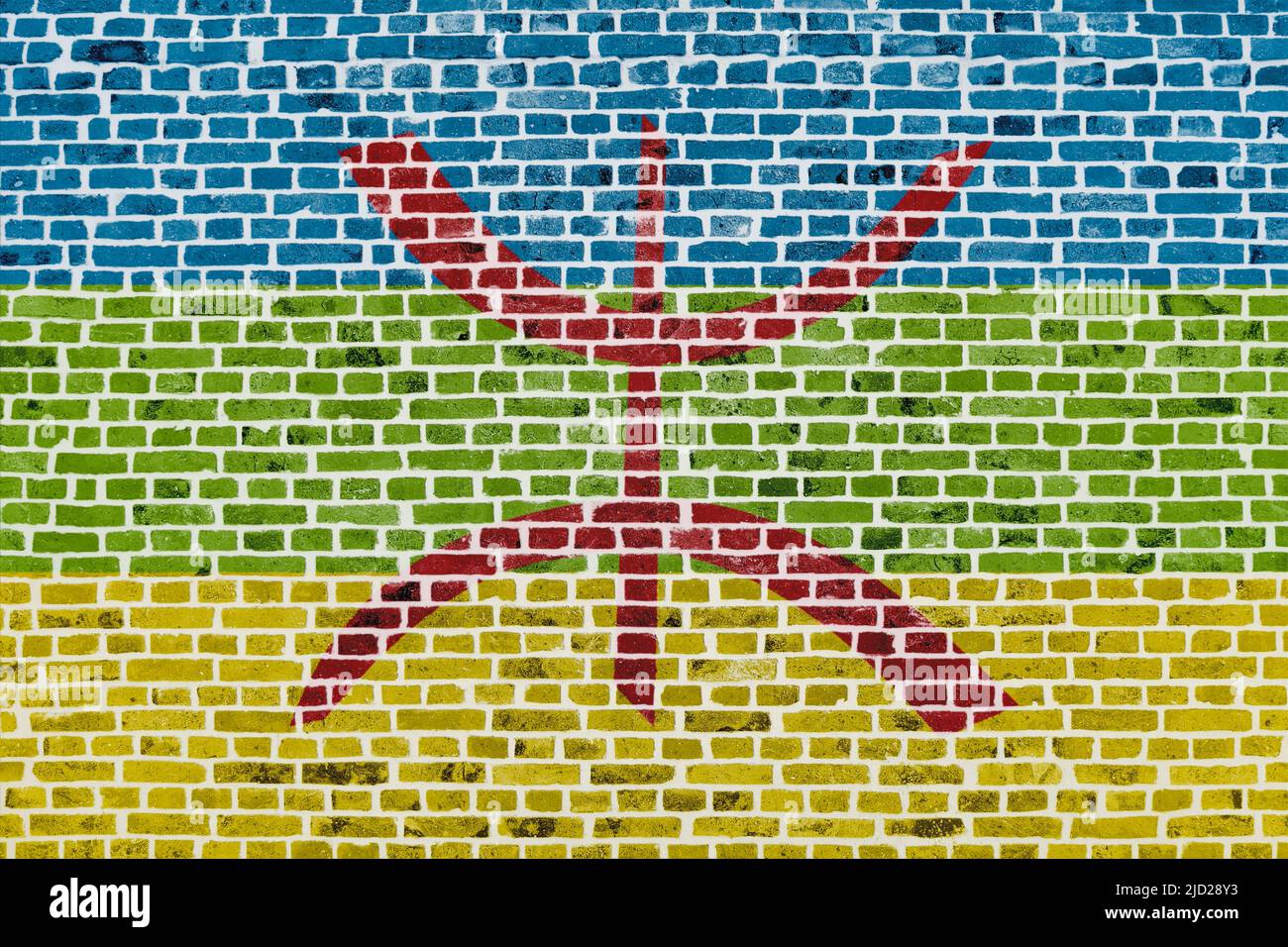 Close-up on a brick wall with the flag of Berber painted on it. Stock Photo