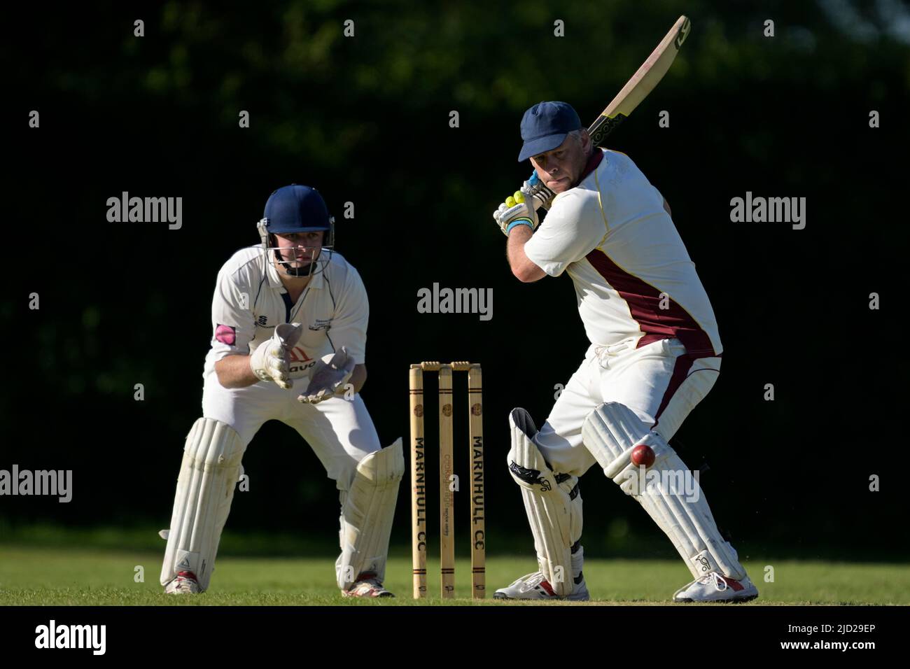 Cricket batsman in action. Stock Photo