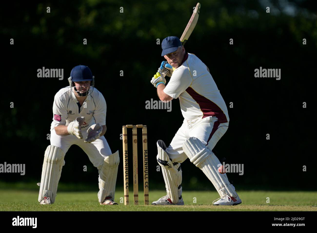 Cricket batsman in action. Stock Photo