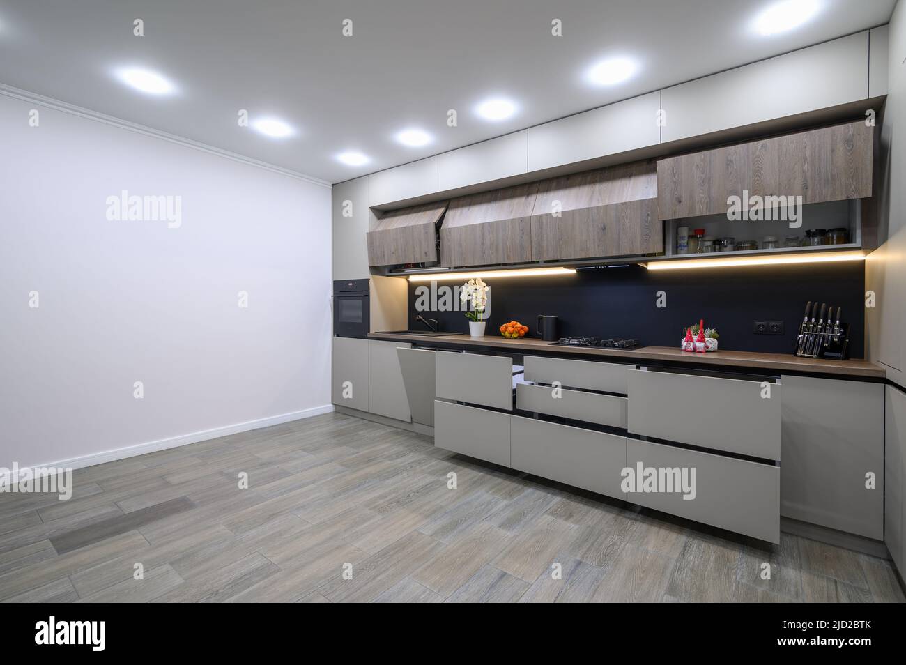 Trendy grey modern kitchen interior with minimalistic furniture Stock ...