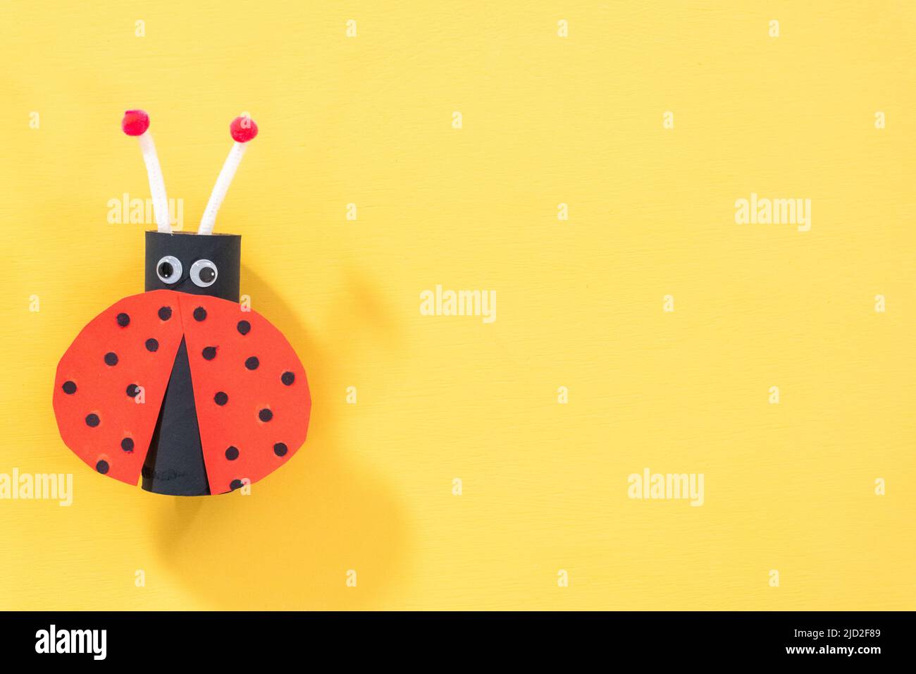 Papercraft project. Colorful bugs made out of empty toilet rolls Stock