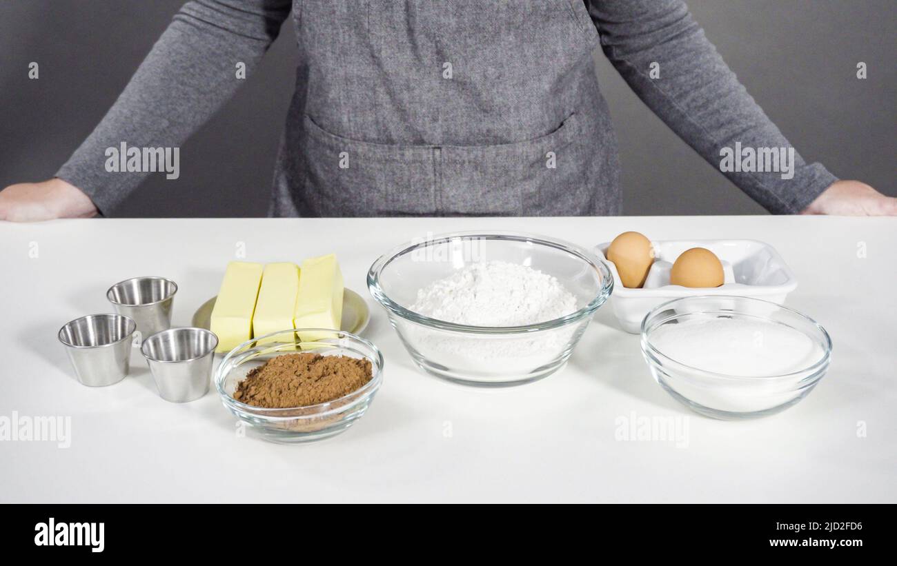 Step by step. Ingredients in a glass mixing bowls to bake chocolate