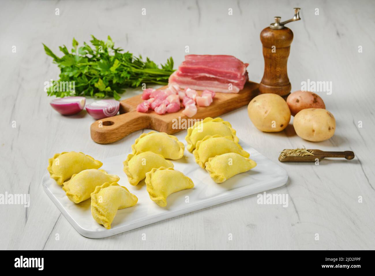 Frozen dumplings with bacon and potato Stock Photo Alamy
