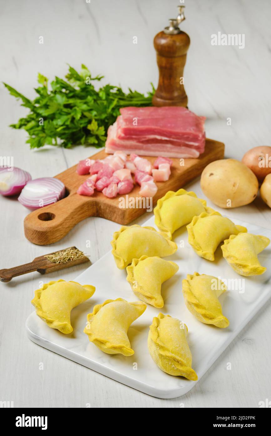 Frozen dumplings with bacon and potato Stock Photo Alamy