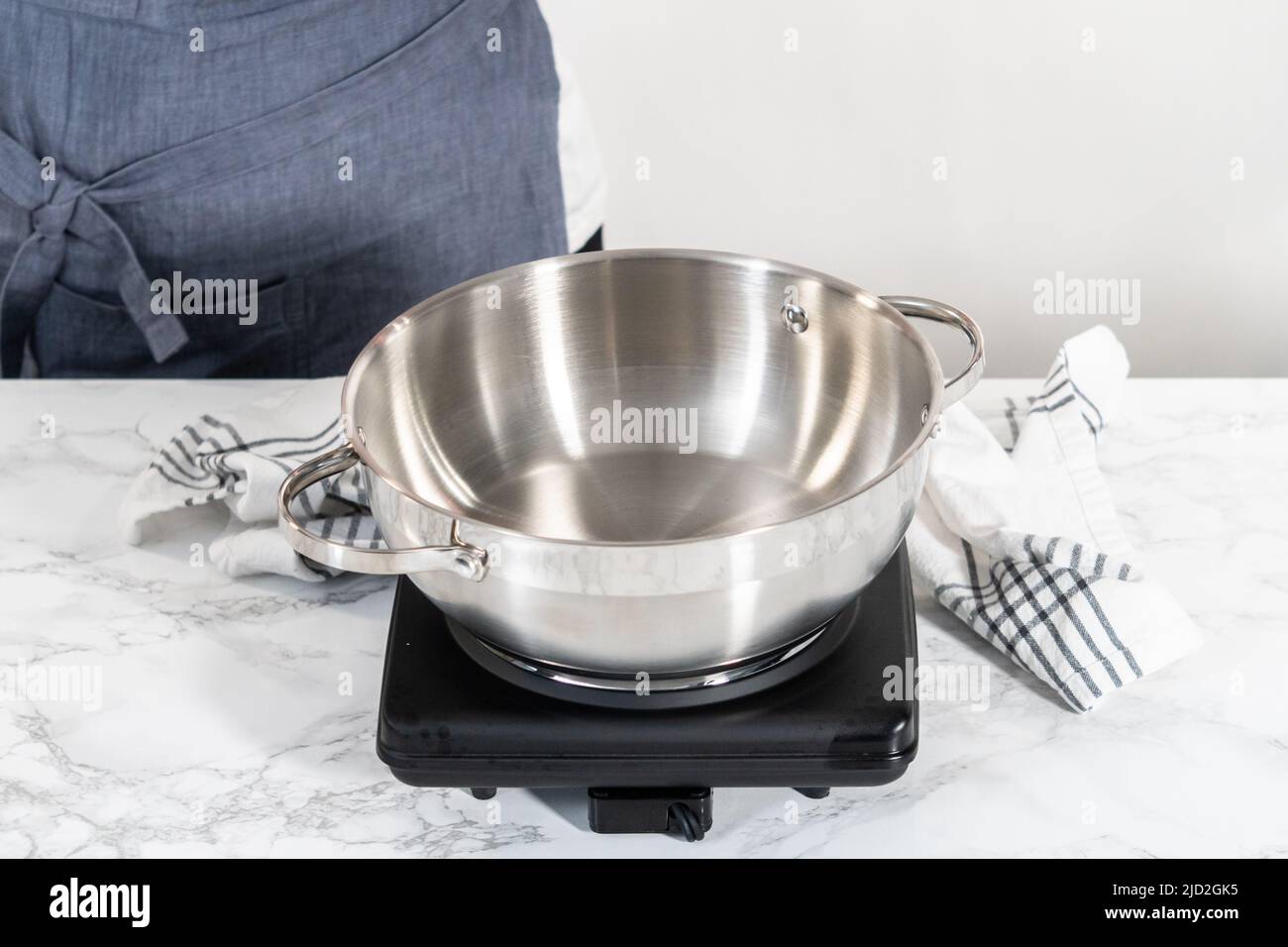 Hispanic Rice Cooking Pot Cooking Mexican rice in a stainless steel cooking pot Stock Photo - Alamy