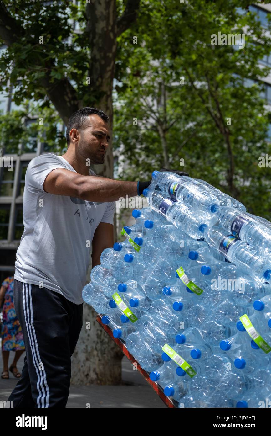 A delivery of water bottles in Barcelona, Spain. Stock Photo