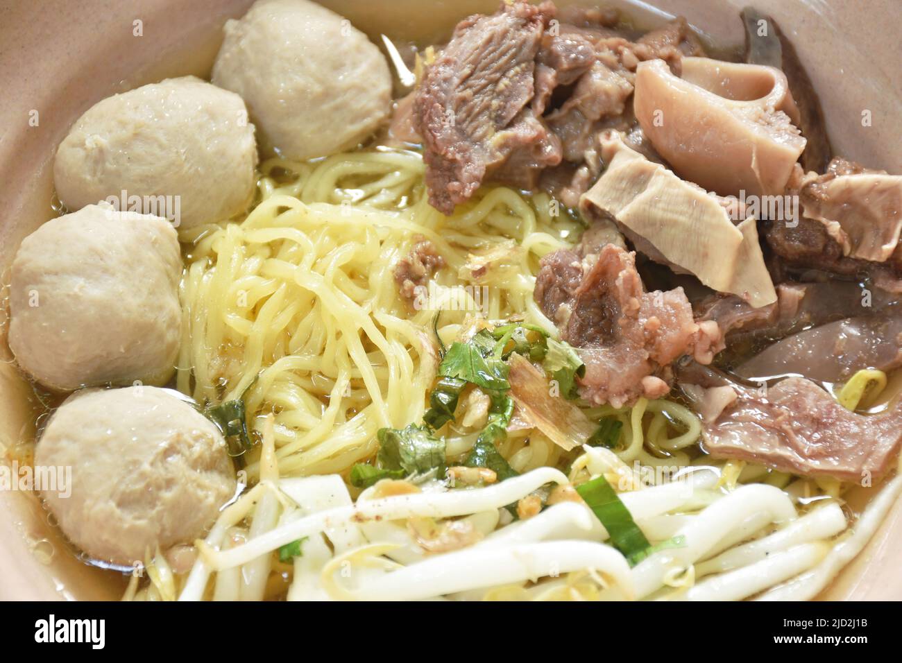 boiled Chinese yellow egg noodles with braised beef and meatball in soup on bowl Stock Photo Alamy